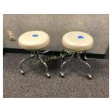 Matching pair of stools on casters