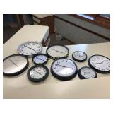 (9) battery operated wall clocks