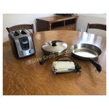 Toaster, pans and a vintage mixer with no beaters.