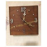Pair of wood battery operated wall clocks