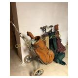 Assortment of golf clubs, bags and caddy