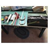 Older tool box with antique tools, horse shoes,