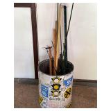 Can with yard sticks ,stakes,and yard art