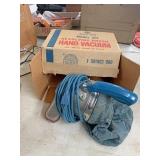 Revolving brush hand vacuum