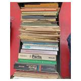 Single drawer cabinet with parts manual gun books