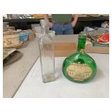 Two glass bottles one MATEUS US forces
