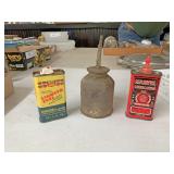 Three oil cans