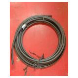 Approximately 50 feet of plastic hose