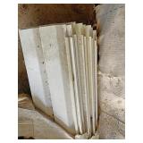Approximately 2 1/2 boxes of white vinyl siding