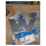 Two boxes full of white emblems