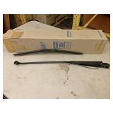 Approximately 20 white GMC Volvo wiper arm