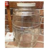 Glass pickle jar lid has been cut for a bank