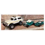 Stomper and two hot wheels red lines