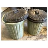 Two trash cans have damage