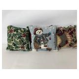 Three holiday door knob pillows