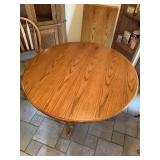 Round kitchen table with one leaf