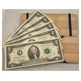 Magic dollar box with five $2.00 bills