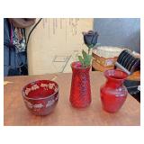 Red glass vases and bowl