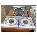 Three wall clocks
