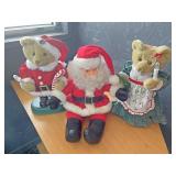 Two Christmas bears and Santa Claus
