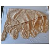 Round crocheted peacock feather table cover