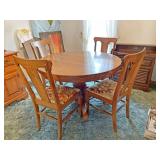 Oak round pedestal table With four splat back
