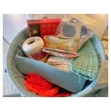 Basket of crochet items hooks finished projects