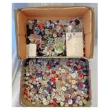2 rectangular boxes of buttons