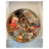 Two round tins of assorted sizes and styles of