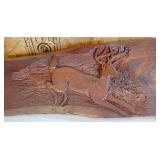 Handcarved base relief deer