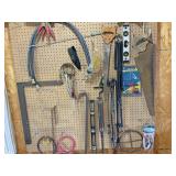 Saw, level, hoses, grease gun crowbar all tools on