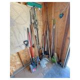 Long handled tools, ratchet strap, pile in corner