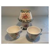 Candle tea light and two large coffee mugs