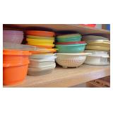 All Tupperware on bottom shelf