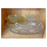 Serving dishes and other on bottom shelf