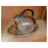 Tea kettle and serving tray On bottom shelf