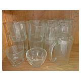 Miscellaneous glassware on bottom shelf