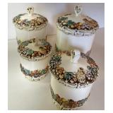 Four piece canister set decorated with fruit