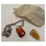 Polished quartz stone and other necklace