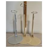Three doll stands