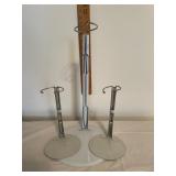 Three metal doll stands