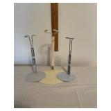 Three metal doll stands