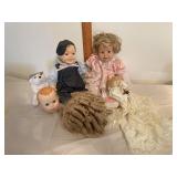 Porcelain and cloth body dolls with spare head