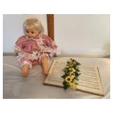 Baby doll and decorated book