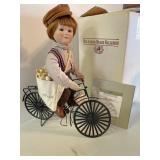 Ashton Drake "Kenny" porcelain doll on bicycle