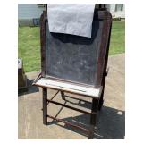 Wooden easel with chalkboard and dry a race board