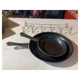 Two pans and hat rack
