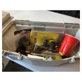 Plastic toolbox with miscellaneous chainsaw parts