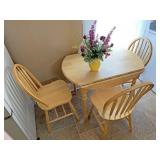 Dropleaf table with three chairs