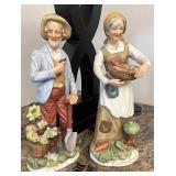 Elderly couple figurines Gentleman has a repair